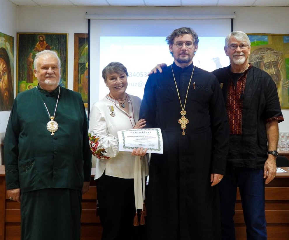 Chris and Rahnella Adsit with Ukrainian Orthodox leaders at a ministry gathering.