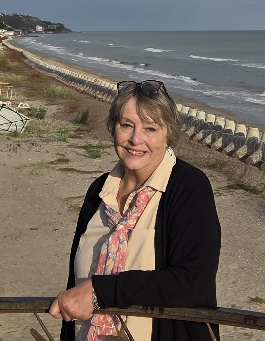 Rahnella standing by the shoreline during a Ukraine ministry trip.